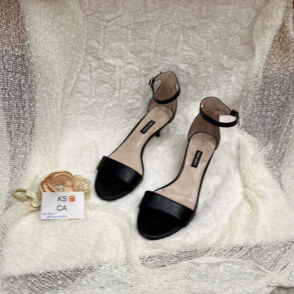 Nine West black with a strap 2 in heel 9M